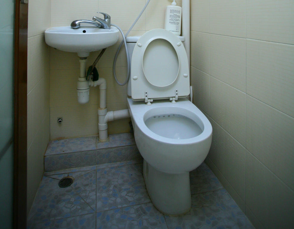 H K Commercial Inn Kaulung Szoba fotó
